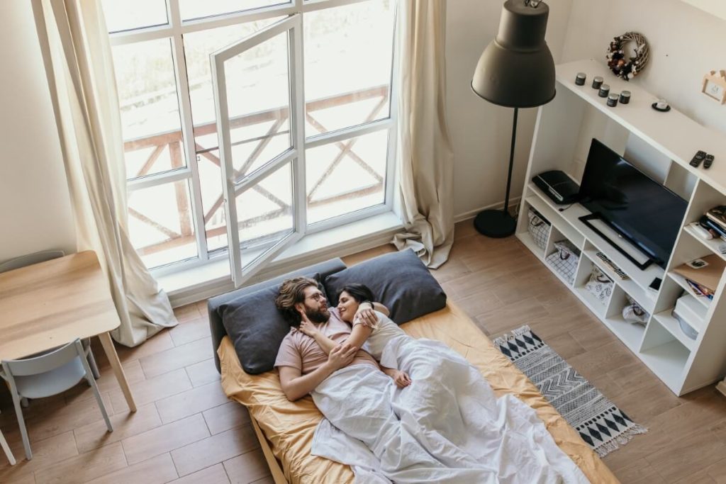 a couple hugging on the sofa